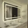 A modern bathroom with a large illuminated mirror above a double vanity with two sinks and faucets. Produktbild-Vorschau
