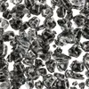 A pile of black, irregular-shaped mineral fragments against a white background. Anteprima dell’immagine prodotto