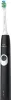 A close-up studio shot of a black electric toothbrush with a green and blue brush head. Voir les images du produit