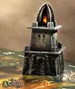 A miniature stone tower with a flame at the top, placed on a game board. Náhľad obrázku produktu