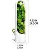 A white and clear plastic herb keeper filled with green herbs, with dimensions indicated. Produktbild-Vorschau