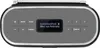 A close-up, front-facing view of a portable Bluetooth speaker with its display screen showing radio station information. Produktbild-Vorschau