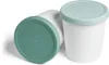 Two white ice cream containers with green lids are shown against a white background. One container is upright, and the other is lying on its side with the lid facing the viewer. Produktbild-Vorschau