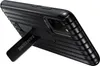A black Samsung phone case with a kickstand is shown from a diagonal angle against a white background. Náhled obrázku produktu