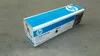 A product box for HP toner is placed on a concrete floor. Náhled obrázku produktu