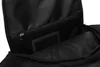 A close-up view of the interior of a black backpack, showing a mesh pocket with a zipper. Náhled obrázku produktu