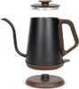 A black electric kettle with a wooden handle and base, shown disassembled with its lid and base plate. Anteprima dell’immagine prodotto