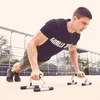 A man is doing push-ups outdoors with push-up bars. Náhľad obrázku produktu