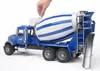 A toy cement mixer truck is shown from a side angle with a hand operating a control on the mixer drum. Podgląd zdjęcia produktu