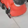 A close-up view of an electric planer working on a light-colored surface. Produktbild-Vorschau