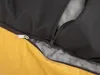 A close-up view of a zipper on a yellow and black pet bed. Produktbild-Vorschau