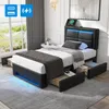 A bedroom scene featuring a black upholstered bed with LED lighting and storage drawers. Podgląd zdjęcia produktu