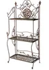 A vintage-style metal shelf unit with three tiers, decorated with leaf and bird motifs. Anteprima dell’immagine prodotto