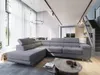 A modern living room with a large sectional sofa, coffee table, and stairs leading to an upper level. Produktbild-Vorschau