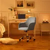 A home office setup with a desk, chair, and bed. Produktbild-Vorschau