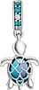 A silver turtle charm with blue and teal stones. Anteprima dell’immagine prodotto