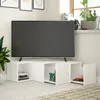 A modern white TV stand with storage compartments, holding a television and decorative items. Produktbild-Vorschau