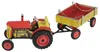 A toy tractor with a trailer, shown from a side-diagonal angle against a white background. Produktbild-Vorschau
