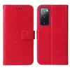 A red flip phone case with a floral and butterfly embossed design is shown open, displaying the inside and the phone it protects. The case is presented in two views side-by-side. Produktbild-Vorschau