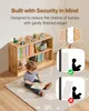 A child is reading a book on a rug in front of a wooden bookshelf filled with books and toys. There are also diagrams illustrating safety features. Podgląd zdjęcia produktu