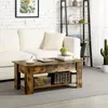 A living room scene with a couch, coffee table, and shelf. Produktbild-Vorschau