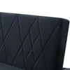 A close-up view of the diamond-stitched upholstery of a dark gray sofa. Voir les images du produit