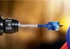 A close-up shot of a drill bit attached to a drill. Produktbild-Vorschau