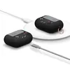 Two black AirPods Pro cases designed to look like retro handheld game consoles are shown. One is connected to a charging cable, and the other is placed on a white wireless charging pad. Produktbild-Vorschau
