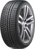 A close-up studio shot of a car tire mounted on a silver alloy wheel. Anteprima dell’immagine prodotto