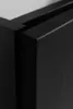 A close-up view of the corner of a black cabinet or furniture piece, showing the joinery and material texture. Náhled obrázku produktu