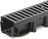 A close-up, angled view of a black drainage channel with a grate on top, set against a white background. Produktbild-Vorschau