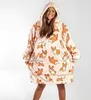 A woman wearing a hooded blanket with a corgi print. Anteprima dell’immagine prodotto
