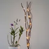 An orchid plant and a decorative branch with LED lights. Podgląd zdjęcia produktu
