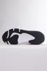 The sole of a black and white athletic shoe is shown against a white background. Náhľad obrázku produktu