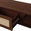 A close-up view of a wooden TV stand with a partially open drawer revealing a rattan front. Produktbild-Vorschau