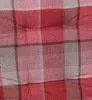 A close-up view of a red and gray plaid fabric. Produktbild-Vorschau