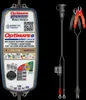 A battery charger and its accessories are displayed against a black background. Voir les images du produit
