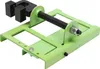 A close-up studio shot of a green metal chainsaw mill attachment on a white background. Náhled obrázku produktu