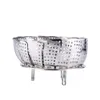 A stainless steel steamer basket with legs, isolated on a white background. Produktbild-Vorschau