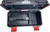 An open black toolbox with red accents, showing its internal compartments and handle. Anteprima dell’immagine prodotto