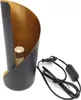 A table lamp with a black exterior and gold interior, shown with its power cord. Voir les images du produit