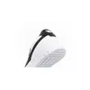 A close-up view of the heel and sole of a white Puma sneaker with black accents. Voir les images du produit