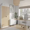 A well-lit office space with modern furniture, including a filing cabinet and a desk with a laptop and chair. Voir les images du produit