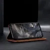 A brown leather flip case for a smartphone is shown in a studio setting. Produktbild-Vorschau