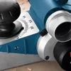 Close-up of a blue and silver power planer with measurement markings. Voir les images du produit