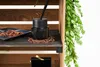 A close-up view of a shelf with decorative items, including a diffuser and spices. Podgląd zdjęcia produktu