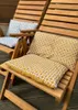 Two wooden chairs with cushions on a wooden deck. Náhled obrázku produktu