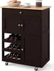 A dark brown kitchen cart with a wooden countertop is shown against a white background. It features a drawer, two cabinets, and a wine rack. There are also some food items and a cup on the countertop. Podgląd zdjęcia produktu