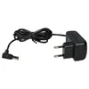 A black power adapter with a coiled cable and a European plug. Produktbild-Vorschau