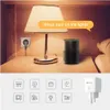 A smart plug and a smart speaker are shown on a nightstand next to a lamp, illustrating voice control. Voir les images du produit